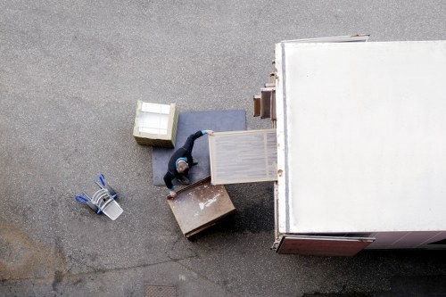 Local office moving team handling furniture in Streatham