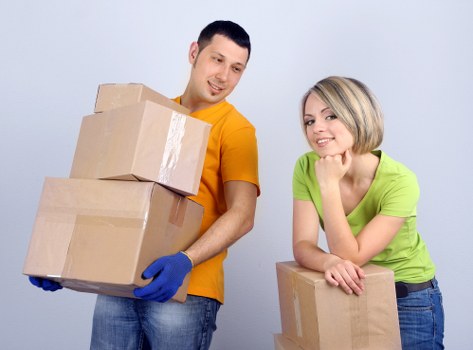 Moving boxes and furniture being loaded for a Streatham move